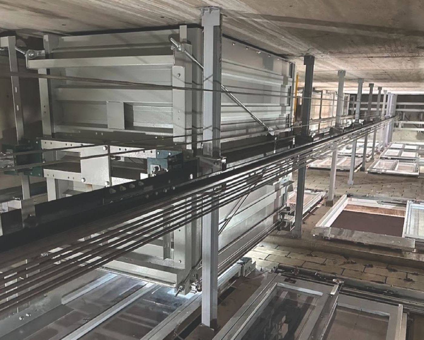 Elevator shaft interior showing guide rails and mechanical components