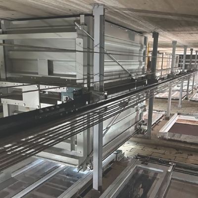 Elevator shaft interior showing guide rails and mechanical components