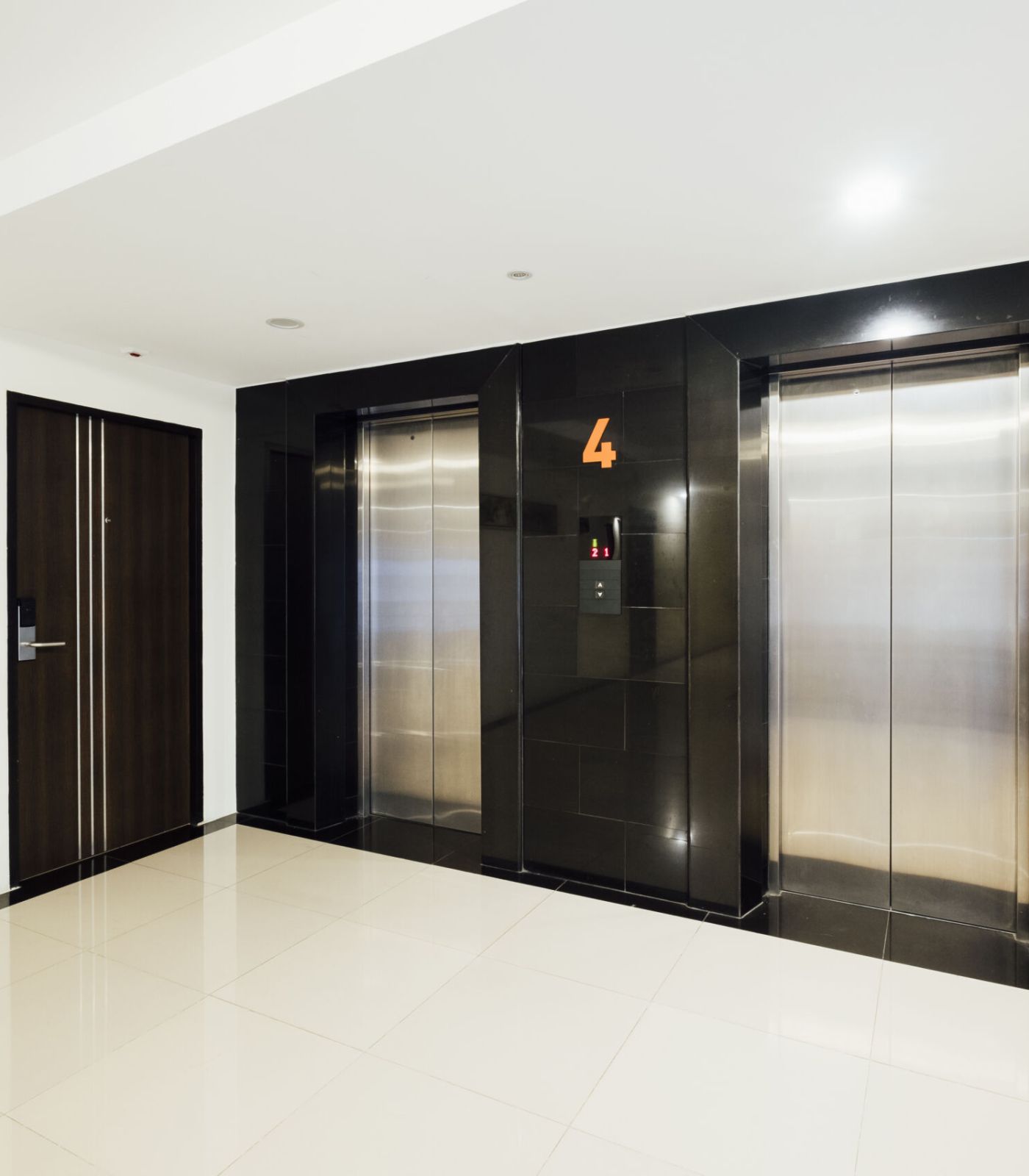 Sleek modern elevator entrance in a commercial building lobby