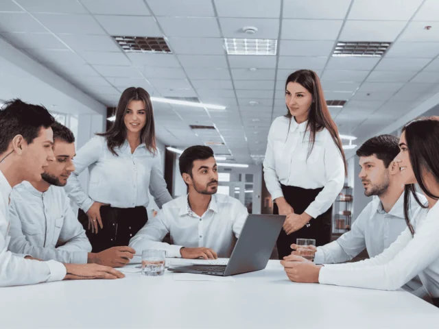 Elevator industry professionals collaborating in a modern office