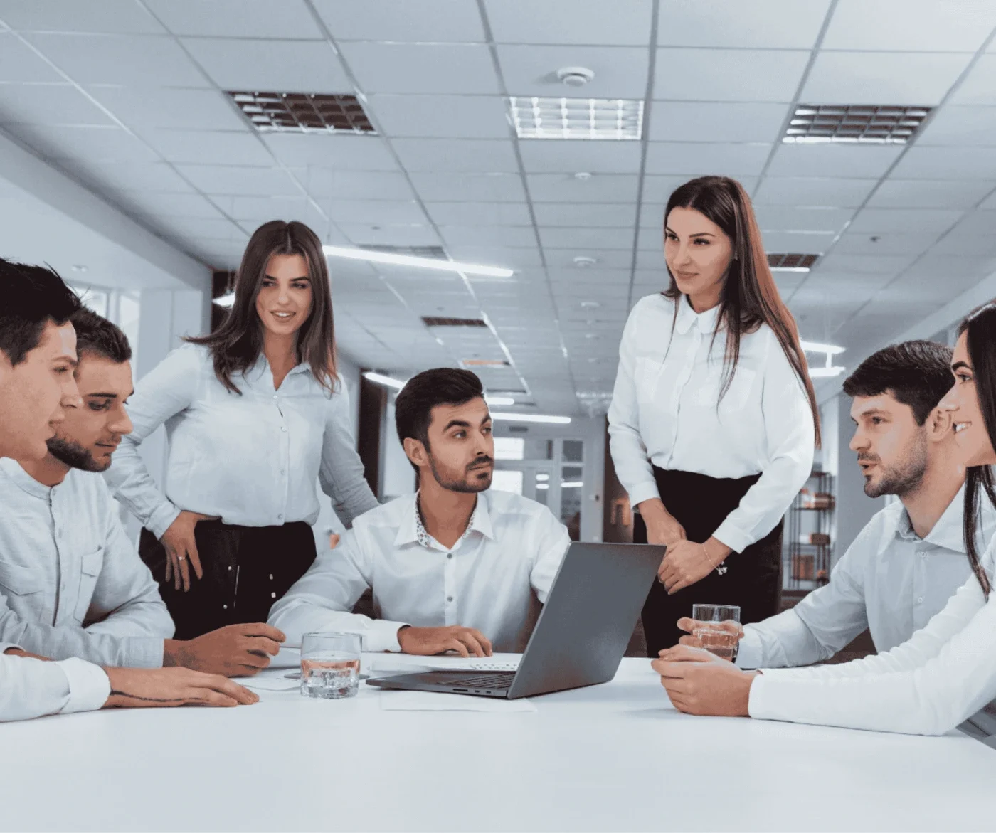 Elevator industry professionals collaborating in a modern office