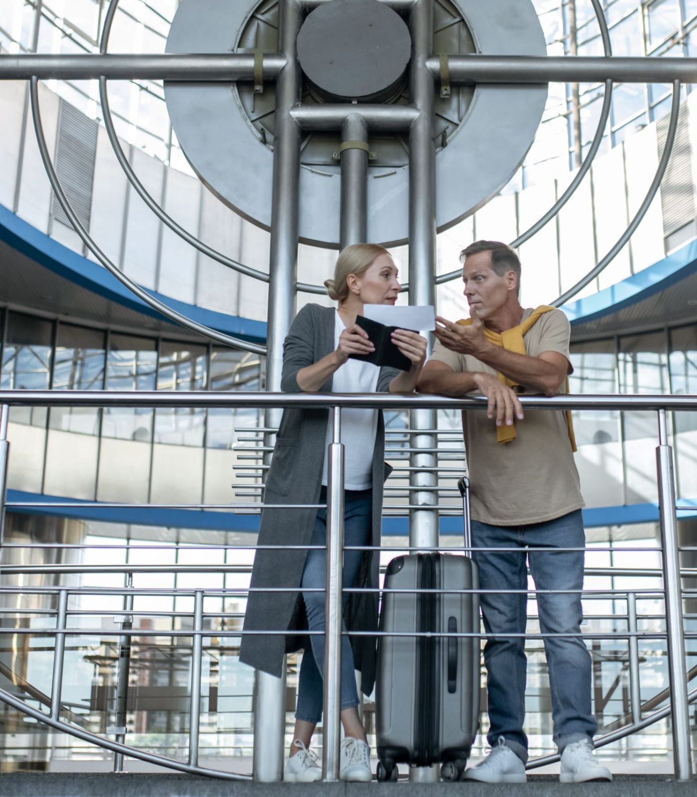 focused middle aged man and woman having a discussion over the lift industry