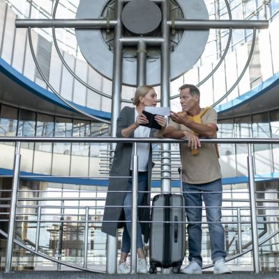 focused middle aged man and woman having a discussion over the lift industry
