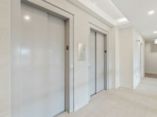 2 elevators doors in building hall