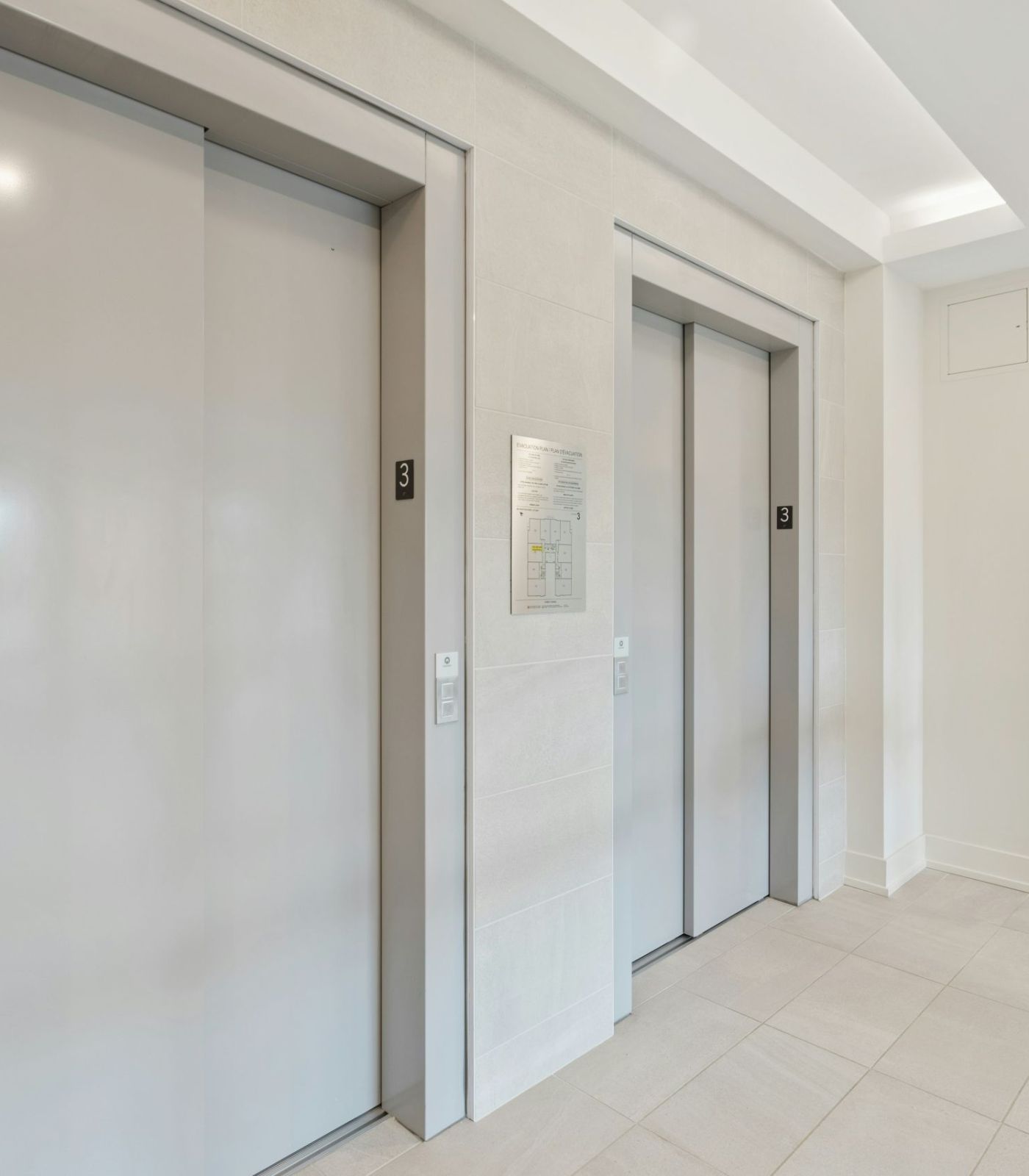 2 elevators doors in building hall