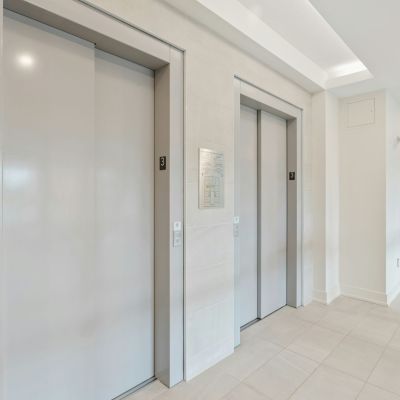 2 elevators doors in building hall